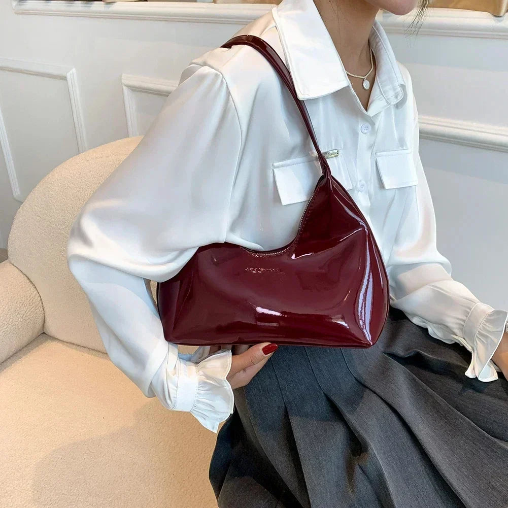 Elegant burgundy shoulder bag with a patent finish
