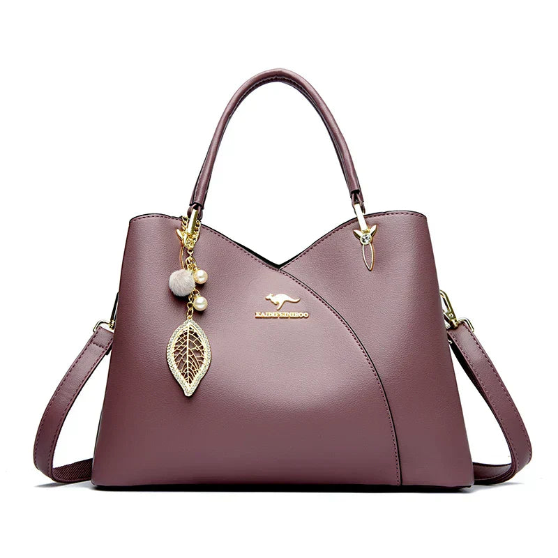 Elegant black shoulder bag with stylish charms